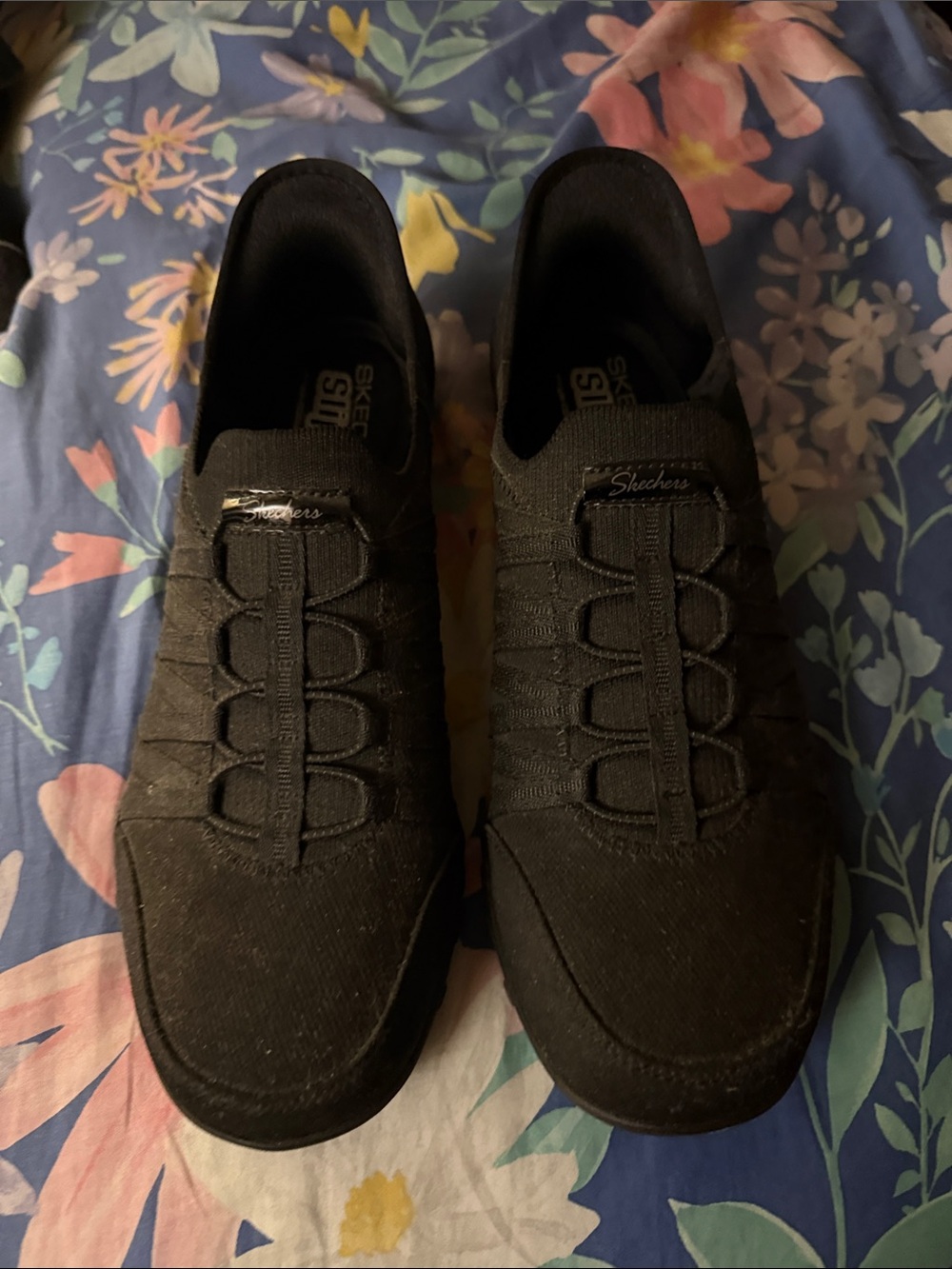 Skechers women’s Black Slip-On Stretch Fabric Sneakers